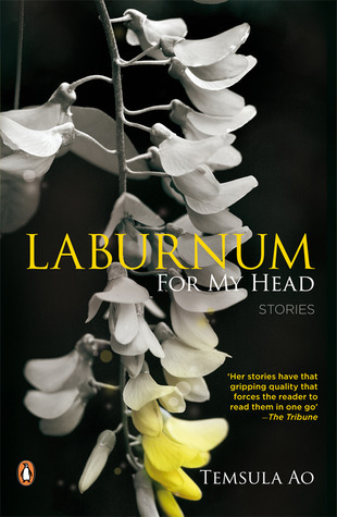 The cover of Laburnum For My Head with laburnum flowers on a black background. The flowers are white with a hint of yellow in the bottom. 