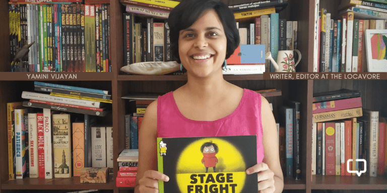 photo of yamini vijayan, a woman, holding a book. She is the editor of the food stories venture, The Locavore